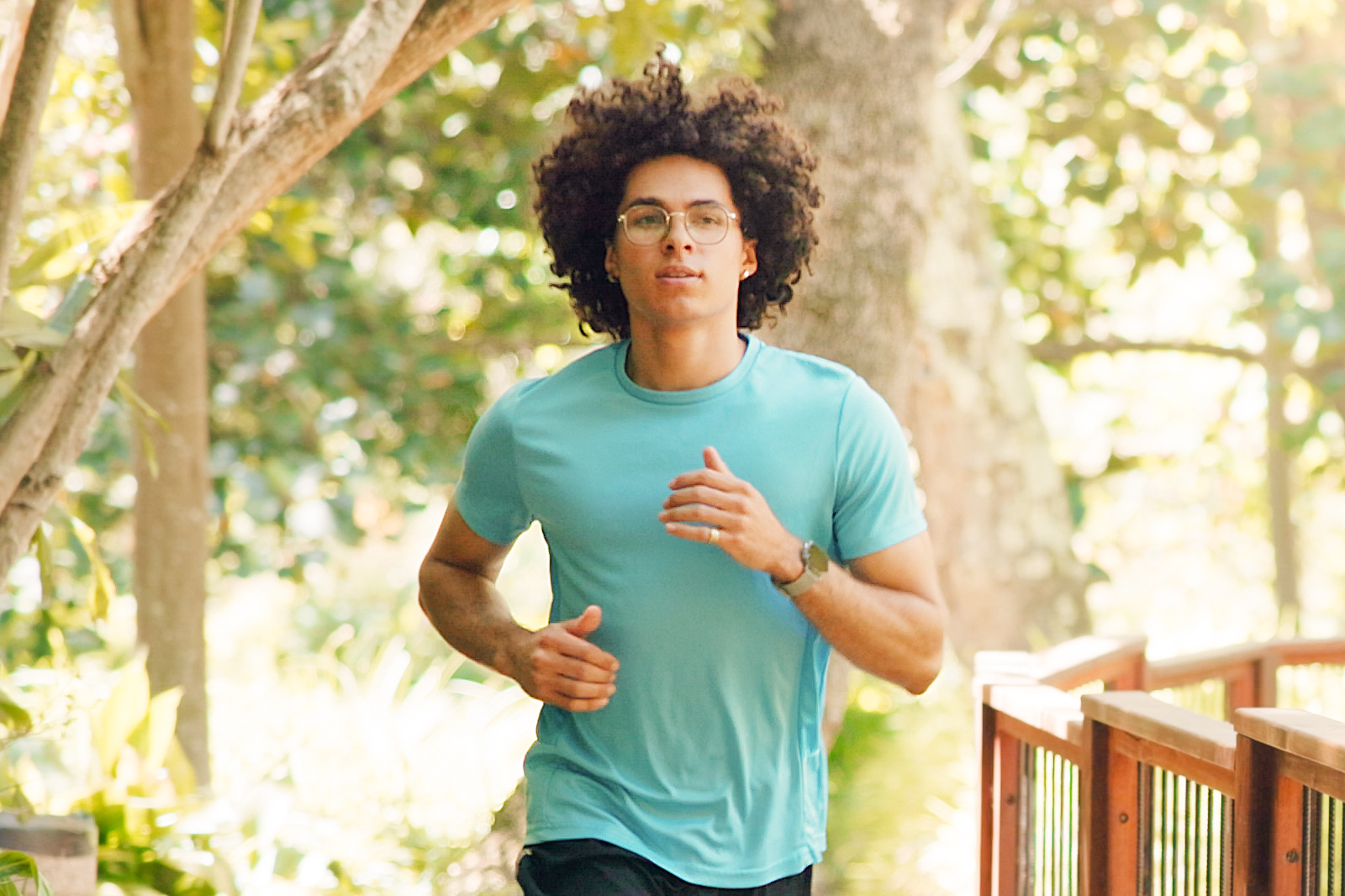Young man jogging outdoors on a sunny day